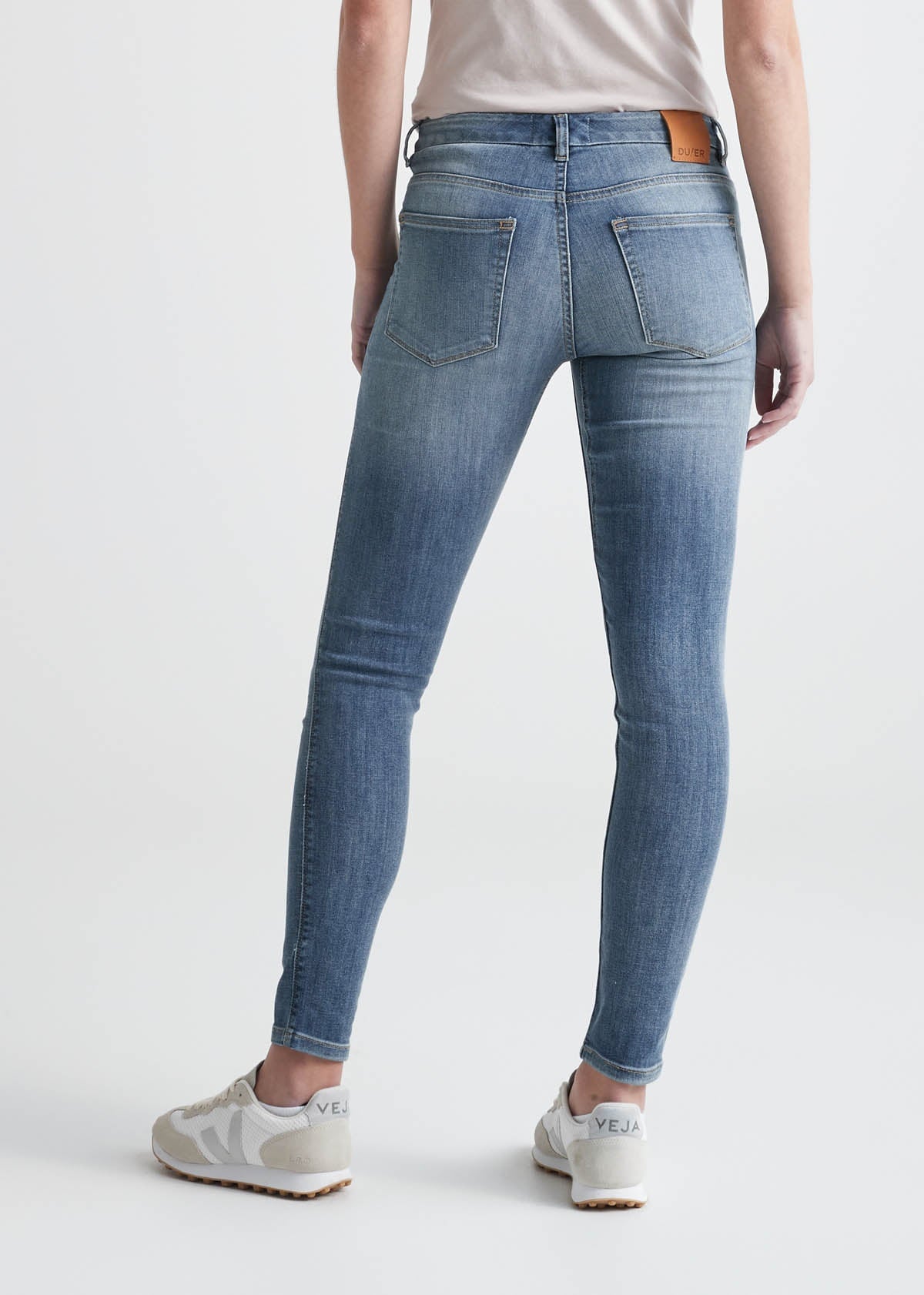 womens light blue mid rise skinny stretch jeans back
